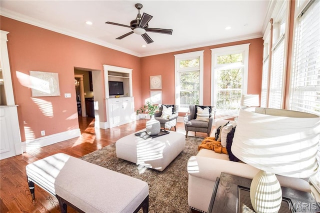 5076 Westminster Pl, Saint Louis, MO 63108 - living area featuring crown molding, wood finished floors, baseboards, a ceiling fan, and recessed lighting