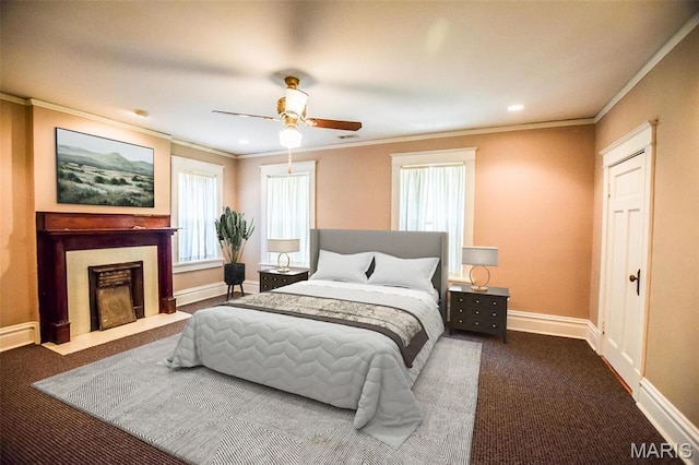 5076 Westminster Pl, Saint Louis, MO 63108 - bedroom with dark carpet, crown molding, baseboards, a fireplace with flush hearth, and ceiling fan