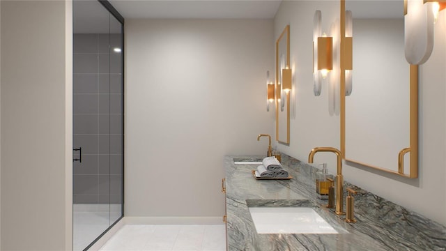 full bathroom with a tile shower, double vanity, baseboards, and tile patterned floors