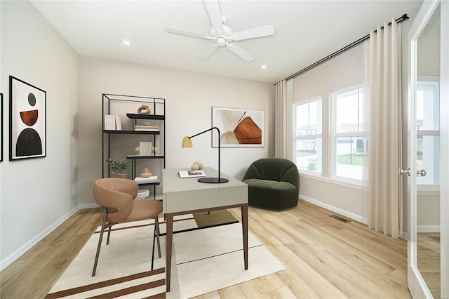 office with light wood-style floors, baseboards, a ceiling fan, and recessed lighting