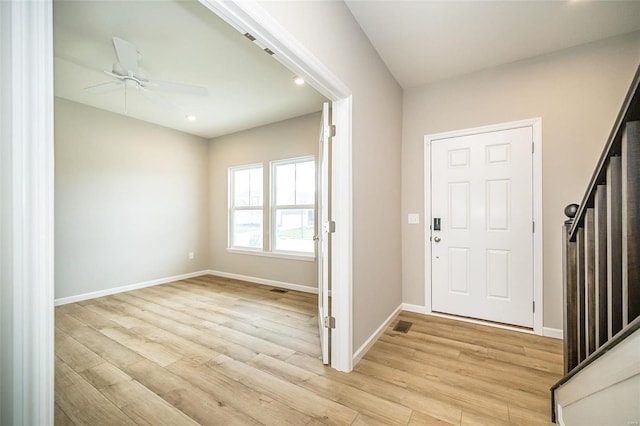 foyer featuring light wood-style flooring, baseboards, ceiling fan, and recessed lighting
