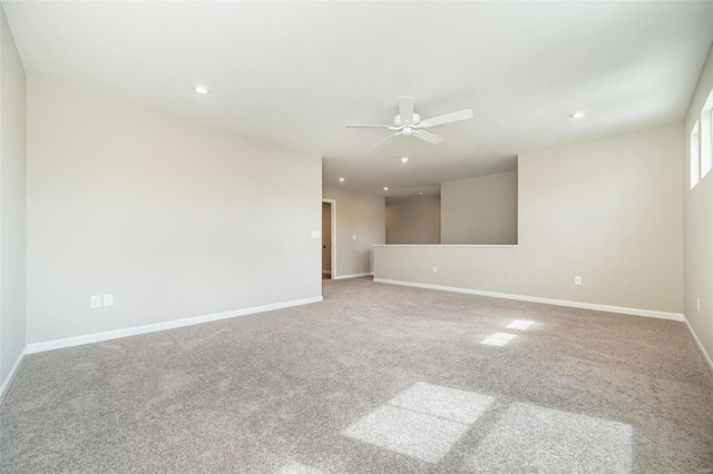 empty room with ceiling fan, recessed lighting, carpet floors, and baseboards