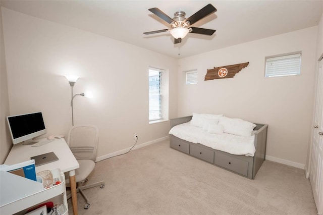 bedroom featuring carpet flooring, baseboards, ceiling fan, and an office area