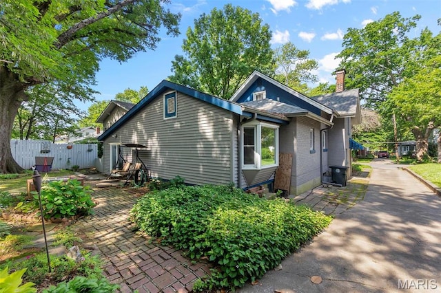 374 N Park Ave, Cape Girardeau, MO 63701 - view of home's exterior with a chimney and brick siding