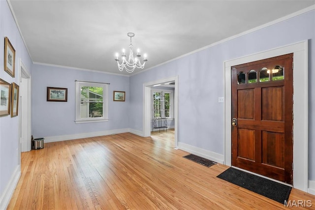 374 N Park Ave, Cape Girardeau, MO 63701 - foyer entrance with a chandelier, light wood-style flooring, ornamental molding, and baseboards