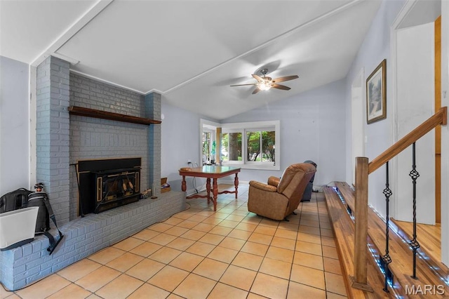 374 N Park Ave, Cape Girardeau, MO 63701 - living room with lofted ceiling, a ceiling fan, a brick fireplace, and light tile patterned floors