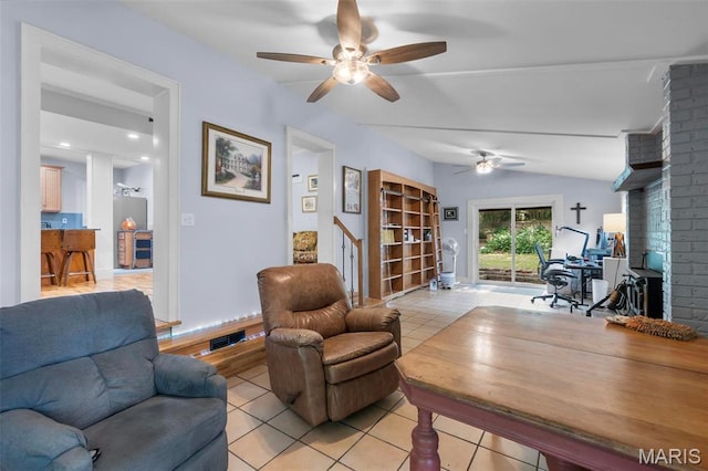 374 N Park Ave, Cape Girardeau, MO 63701 - living area featuring light tile patterned floors, ceiling fan, a desk, and vaulted ceiling