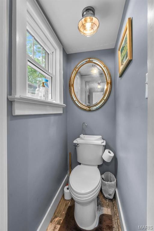 374 N Park Ave, Cape Girardeau, MO 63701 - bathroom featuring baseboards, wood finished floors, and toilet