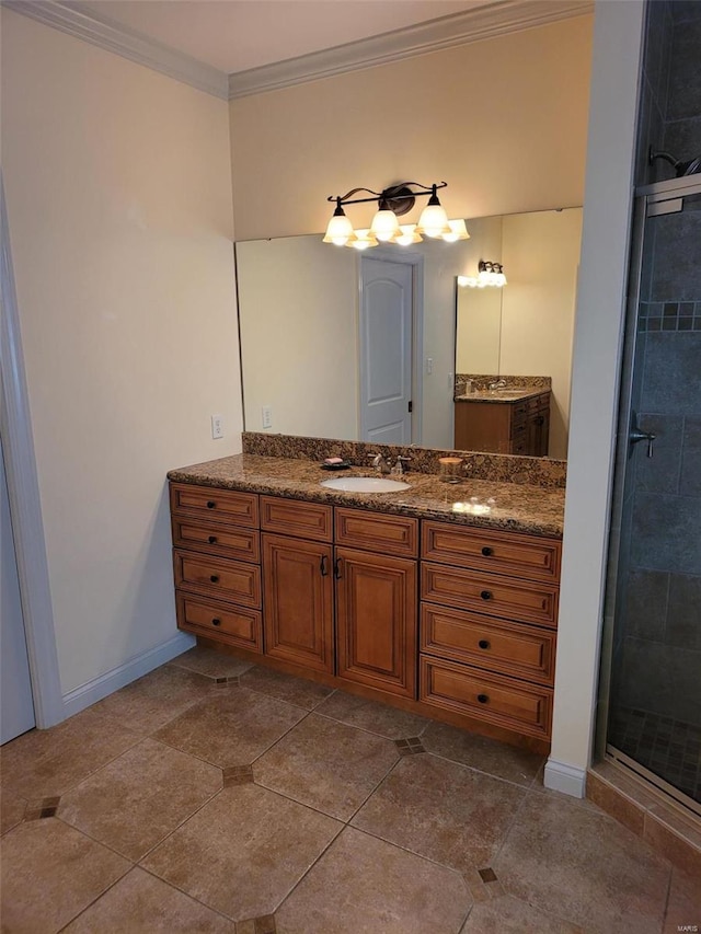 full bathroom with a shower stall, vanity, ornamental molding, and baseboards
