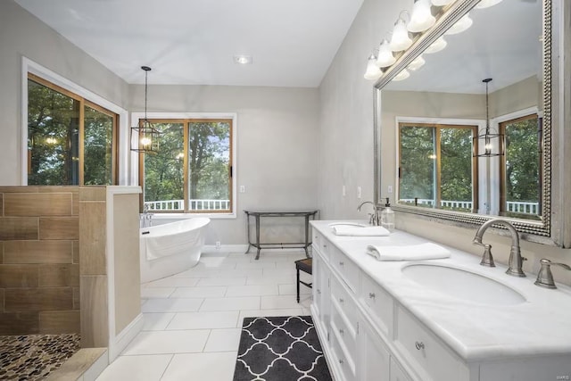 27302 Cimarron Dr, Roaring River Township, MO 65641 - bathroom with a chandelier, tile patterned floors, a freestanding tub, and baseboards