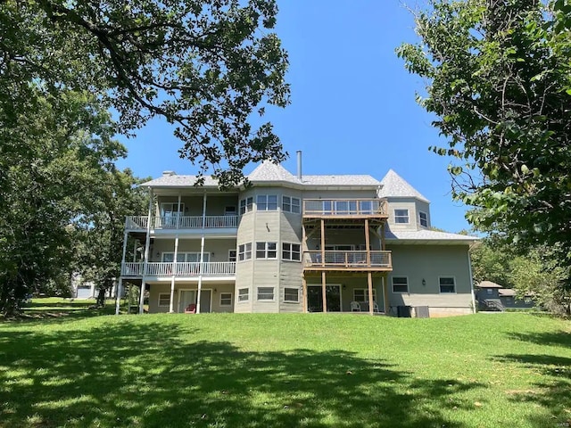 27302 Cimarron Dr, Roaring River Township, MO 65641 - rear view of house with a balcony and a lawn