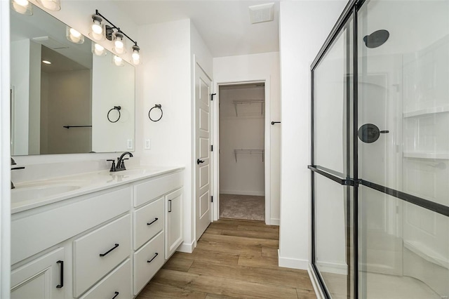 1909 Rolling River Cir, Ofallon, MO 63366 - full bath featuring wood finished floors, a stall shower, double vanity, and a spacious closet