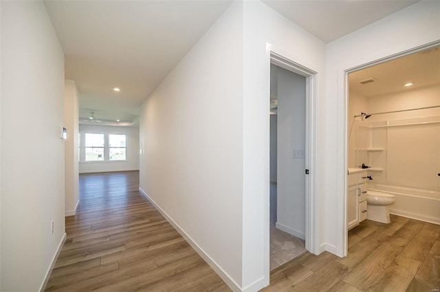 1909 Rolling River Cir, Ofallon, MO 63366 - hallway with light wood-style flooring, recessed lighting, and baseboards