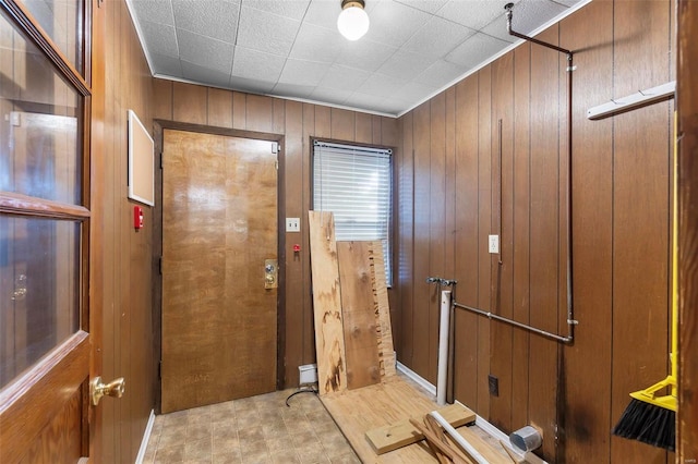 doorway featuring wood walls