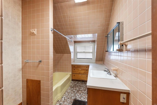 bathroom with tile walls, a tub to relax in, vanity, a shower, and tile patterned flooring