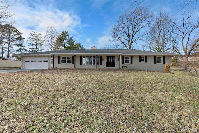 1331 N Cape Rock Dr, Cape Girardeau, MO 63701 - single story home with an attached garage, concrete driveway, a chimney, and brick siding