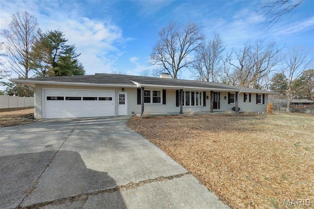 1331 N Cape Rock Dr, Cape Girardeau, MO 63701 - single story home with a garage, driveway, a chimney, brick siding, and a porch
