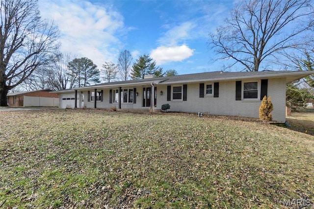 1331 N Cape Rock Dr, Cape Girardeau, MO 63701 - single story home with an attached garage, brick siding, a chimney, and a front lawn