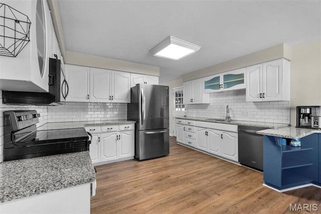 1331 N Cape Rock Dr, Cape Girardeau, MO 63701 - kitchen featuring stainless steel appliances, decorative backsplash, white cabinetry, open shelves, and a sink