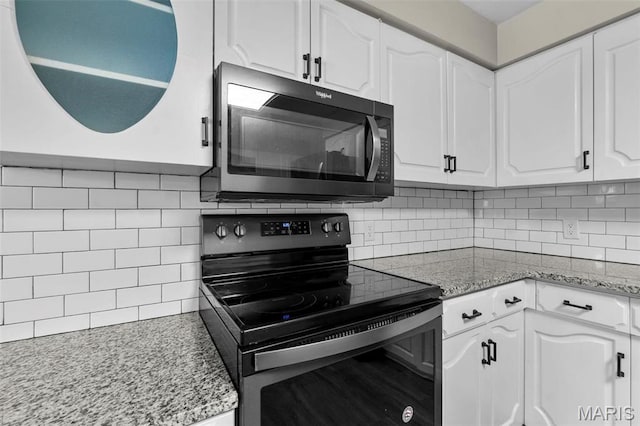 1331 N Cape Rock Dr, Cape Girardeau, MO 63701 - kitchen featuring electric range oven, tasteful backsplash, white cabinetry, and light stone countertops