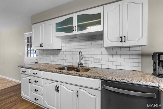 1331 N Cape Rock Dr, Cape Girardeau, MO 63701 - kitchen featuring dishwashing machine, a sink, white cabinets, backsplash, and baseboards