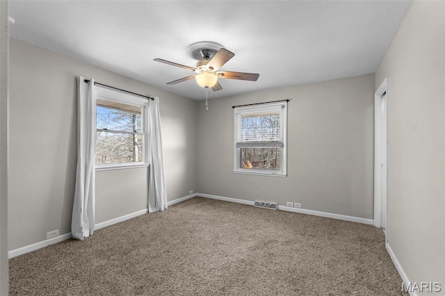 1331 N Cape Rock Dr, Cape Girardeau, MO 63701 - carpeted spare room with healthy amount of natural light, a ceiling fan, and baseboards