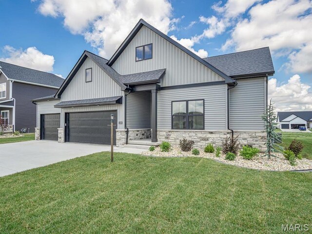3106 Ashley Dr, Glen Carbon, IL 62034 - modern farmhouse with a front lawn, an attached garage, driveway, and a shingled roof