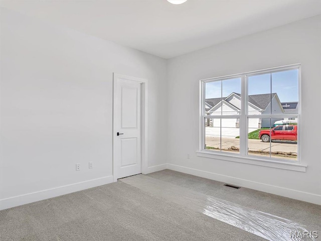 3106 Ashley Dr, Glen Carbon, IL 62034 - empty room with carpet and baseboards