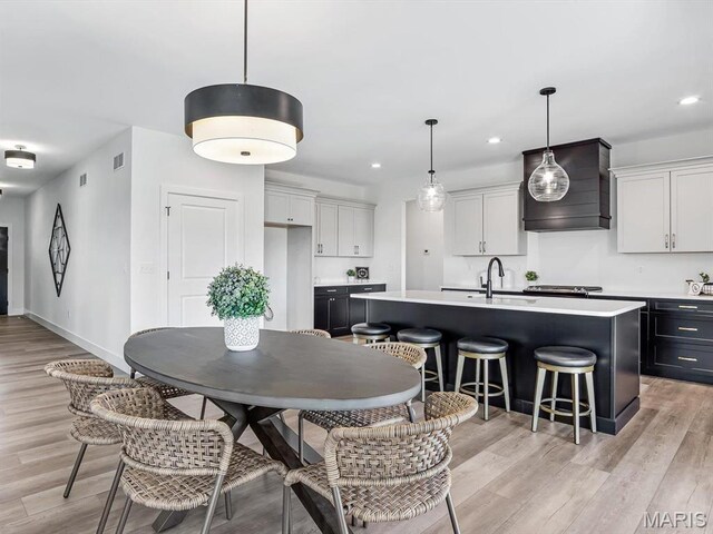 3106 Ashley Dr, Glen Carbon, IL 62034 - dining area with light wood-type flooring, recessed lighting, and baseboards