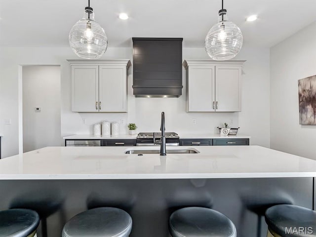 3106 Ashley Dr, Glen Carbon, IL 62034 - kitchen with custom range hood, a sink, hanging light fixtures, light countertops, and recessed lighting