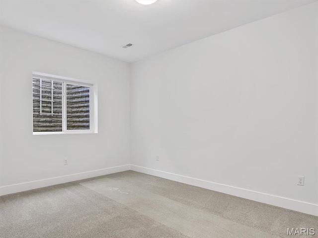 3106 Ashley Dr, Glen Carbon, IL 62034 - empty room with baseboards and light carpet