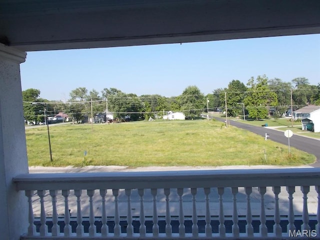 1001 S Main St, Lockwood, MO 65682 - view of grassy yard featuring a balcony