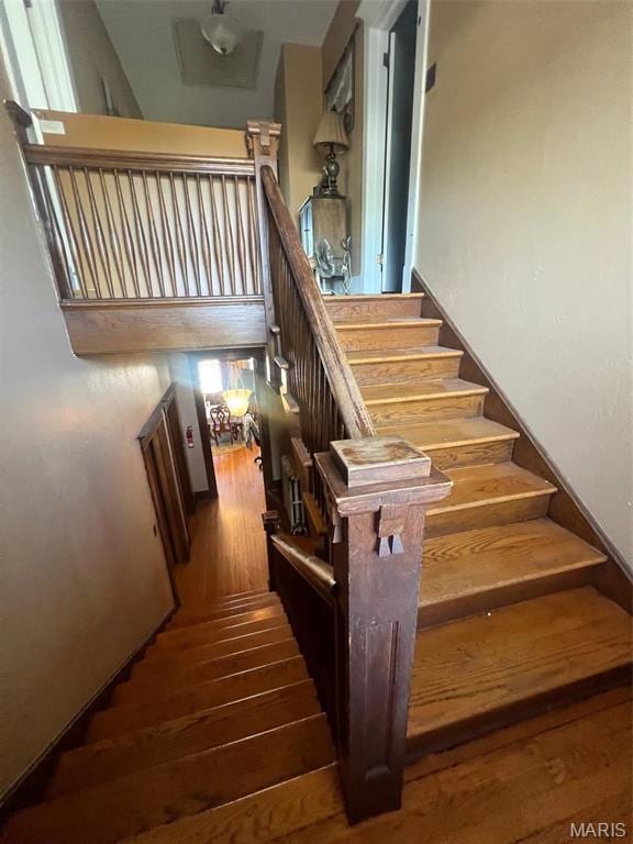 1001 S Main St, Lockwood, MO 65682 - stairway featuring hardwood / wood-style floors
