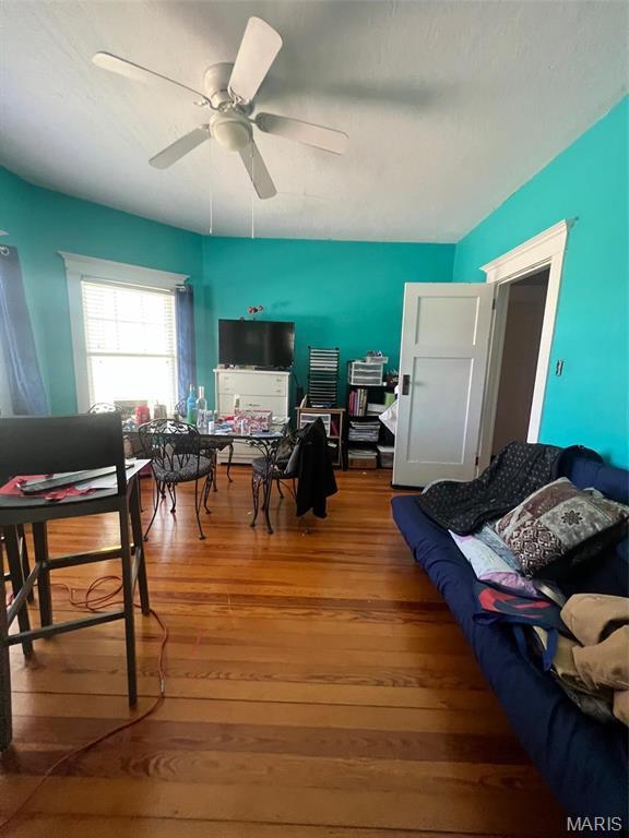 1001 S Main St, Lockwood, MO 65682 - living room with hardwood / wood-style floors, ceiling fan, and a desk