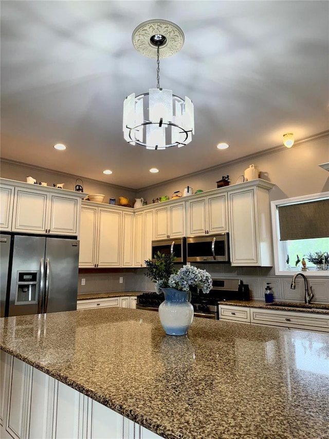 14305 State Highway F, Canton, MO 63435 - kitchen featuring appliances with stainless steel finishes, a chandelier, a sink, decorative backsplash, and dark stone countertops