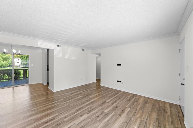 1509 Swallow Dr, Saint Louis, MO 63144 - unfurnished living room with wood finished floors, a chandelier, a textured ceiling, crown molding, and baseboards