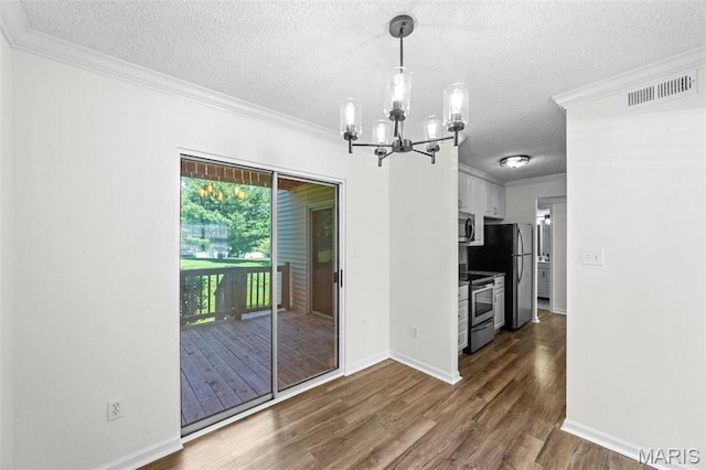 1509 Swallow Dr, Saint Louis, MO 63144 - unfurnished dining area featuring a textured ceiling, dark wood-style floors, a chandelier, crown molding, and baseboards