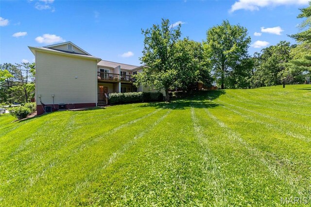 1509 Swallow Dr, Saint Louis, MO 63144 - view of grassy yard featuring a deck