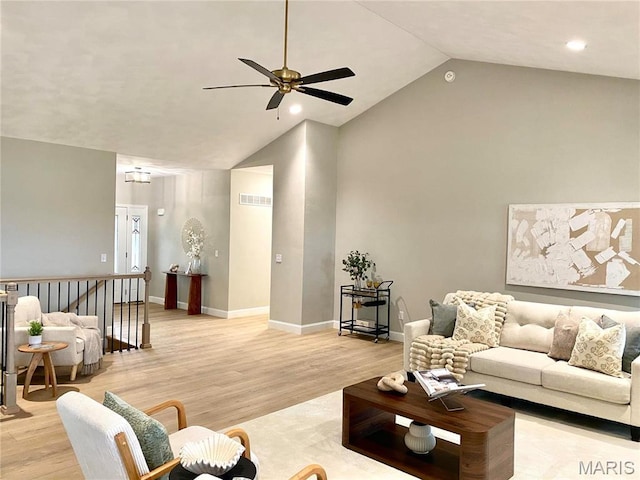 living room featuring a ceiling fan, light wood-type flooring, high vaulted ceiling, baseboards, and recessed lighting