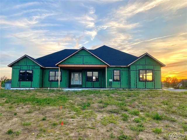 rear view of house featuring board and batten siding