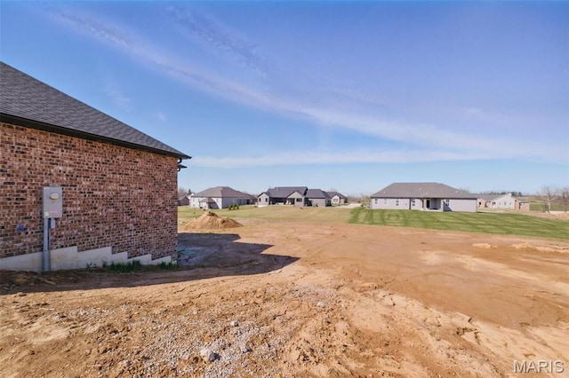 view of yard with a residential view
