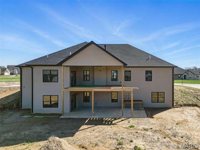 rear view of property featuring a patio