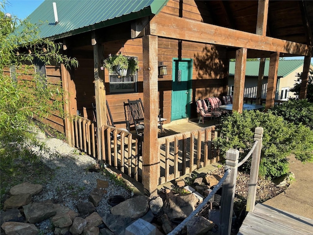 view of side of property featuring metal roof