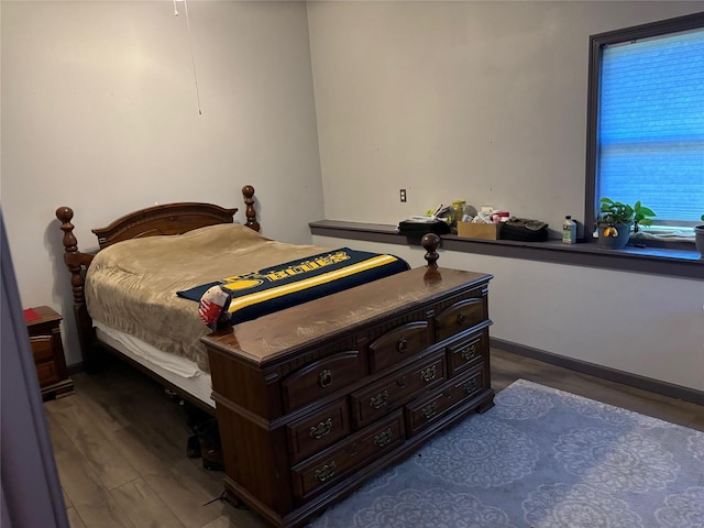 bedroom with wood finished floors
