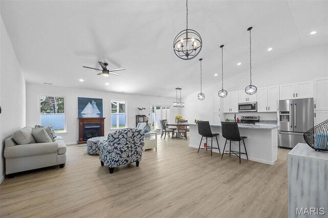 0 Hickory Lndg, De Soto, MO 63020 - living area with a chandelier, light wood-style flooring, a fireplace, a ceiling fan, and recessed lighting