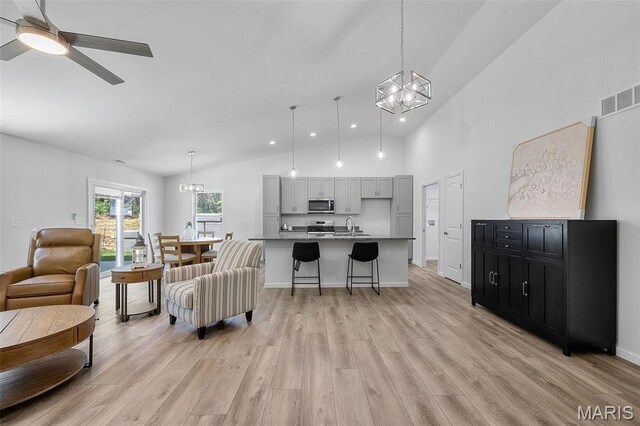 0 Hickory Lndg, De Soto, MO 63020 - living area featuring a chandelier, light wood finished floors, ceiling fan, high vaulted ceiling, and recessed lighting