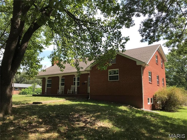 1202 S Gertrude St, Salem, MO 65560 - back of property with brick siding and a lawn