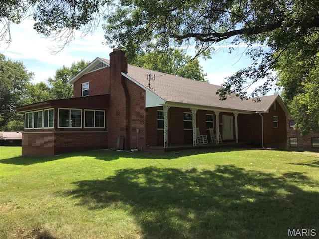 1202 S Gertrude St, Salem, MO 65560 - back of property featuring brick siding, a yard, a chimney, and covered porch