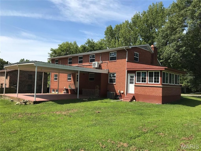 1202 S Gertrude St, Salem, MO 65560 - rear view of property with entry steps, brick siding, a yard, a patio, and a chimney