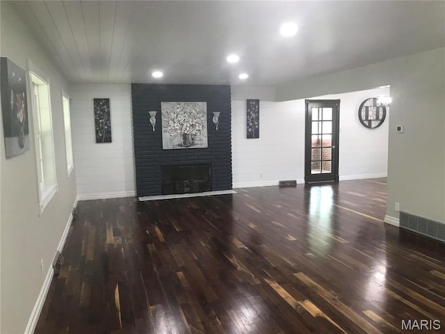 1202 S Gertrude St, Salem, MO 65560 - unfurnished living room with wood finished floors, a fireplace, and recessed lighting